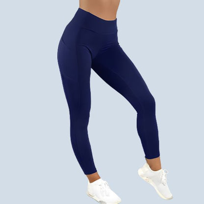 legging sport femme bleu marine taille haute gainant push up fessier extensible avec poches laterales 