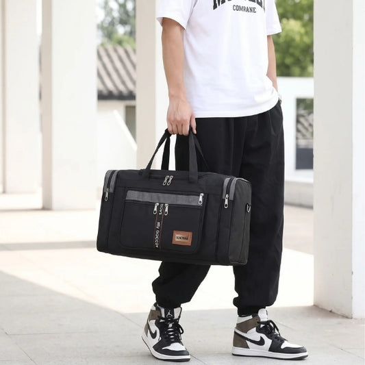 sac de sport homme grand noir porté à la main gym fitness