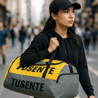 Sac de sport Grand ultra-résistant 56-75L jaune et gris porté en bandoulière
