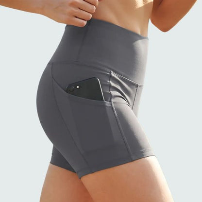 short-de-sport-femme-respirant-confort-poches-gris